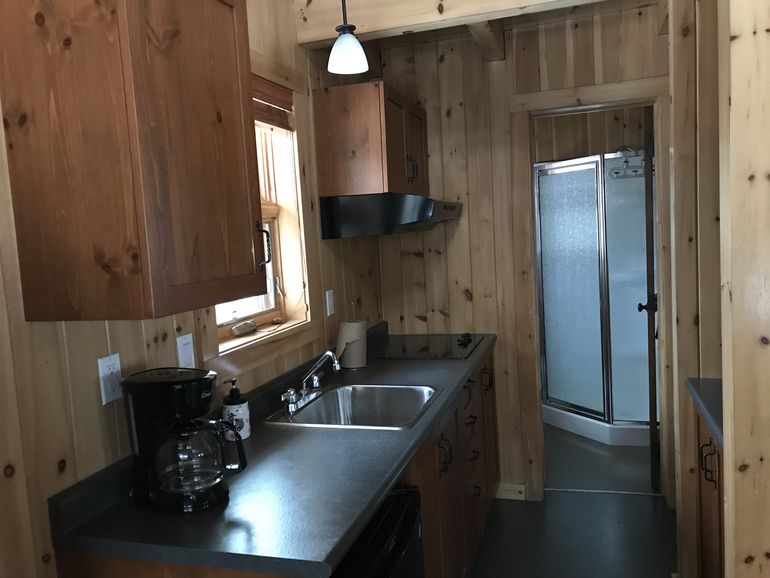 Kitchen corner and shower in the cabin