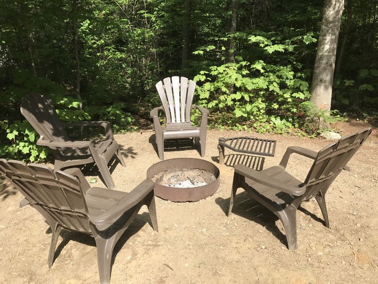 A campfire pit with a grill