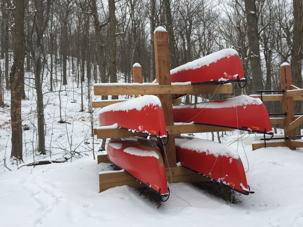 Resting kayaks, covered with snow